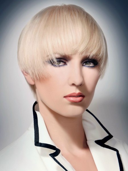 Short blonde helmet-shaped hair with bangs