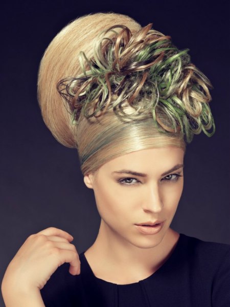 Blonde hair with green tones styled in a turban fashion