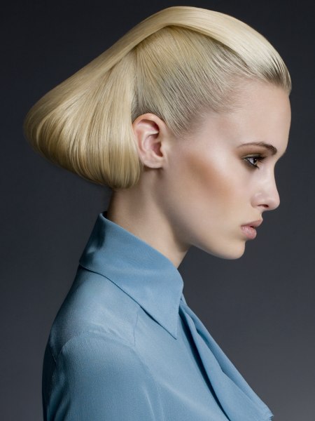 Updo with folded and rolled blonde hair