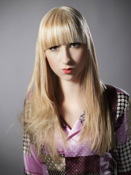 Long and sleek blonde hair style with wide bangs