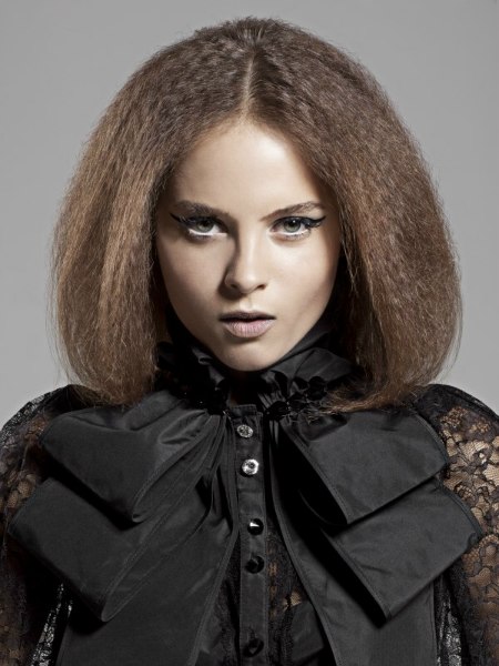 Goth look with crimped hair and a Goth blouse