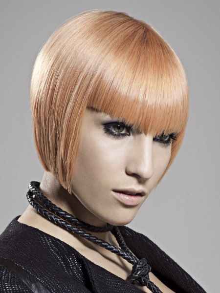 Smooth blonde bob haircut with bangs