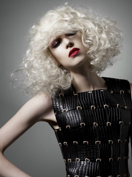 Platinum blonde bob styled into curls