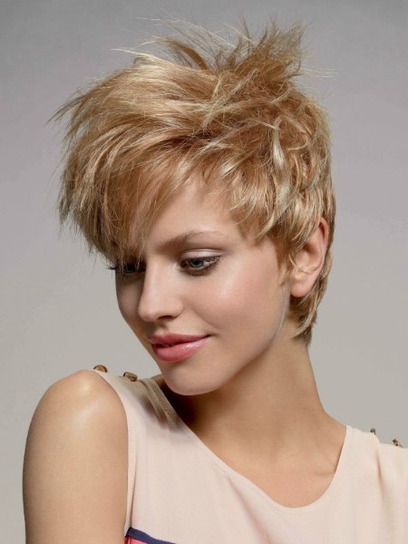 Short blonde pixie cut with layers and bangs
