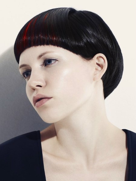 Short round bowl style haircut with a curved fringe