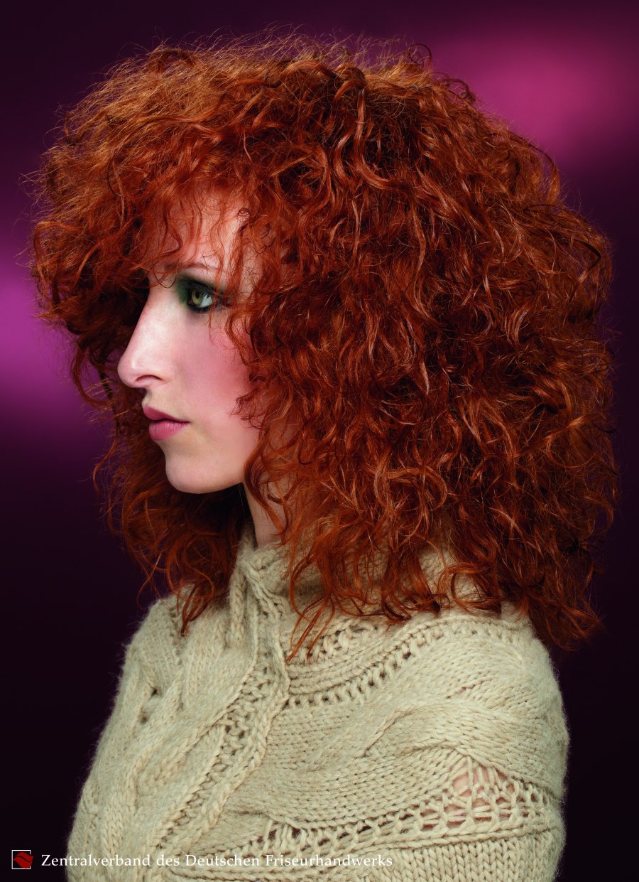 Curly medium long copper hair with a perm