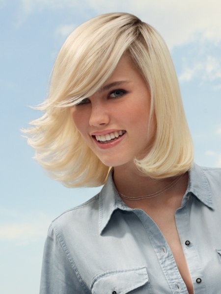 Versatile and sporty medium length blonde hairstyle