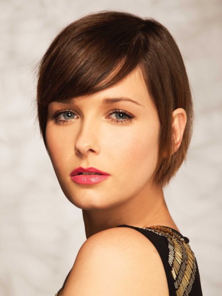 Smooth brunette short haircut with a side part