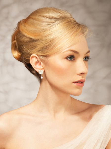 Upstyle with volume on the crown and a chignon