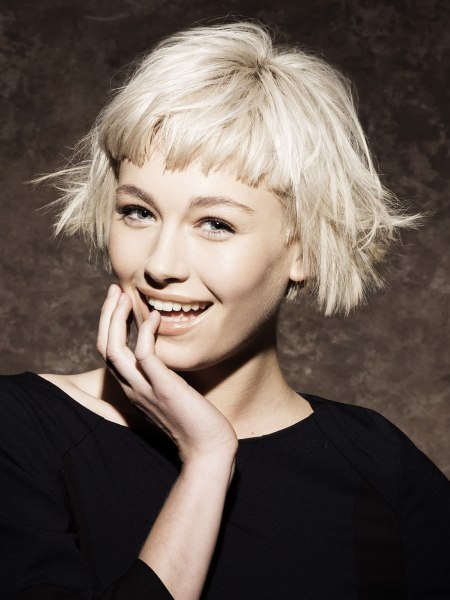 Short bob with bangs and a rugged cutting line