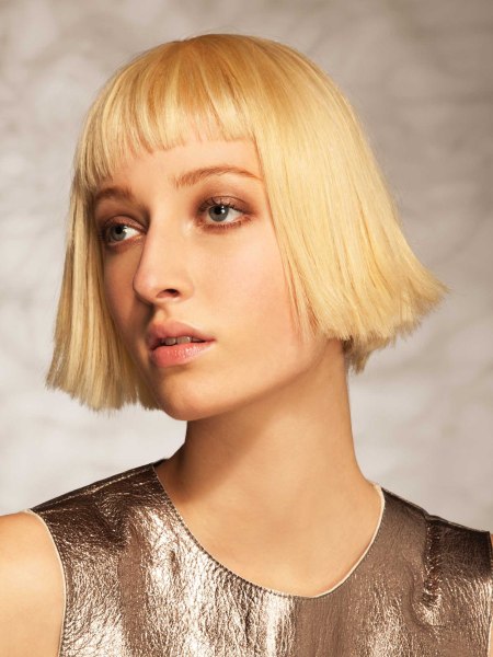 Short jaw-length bob cut with slanted bangs