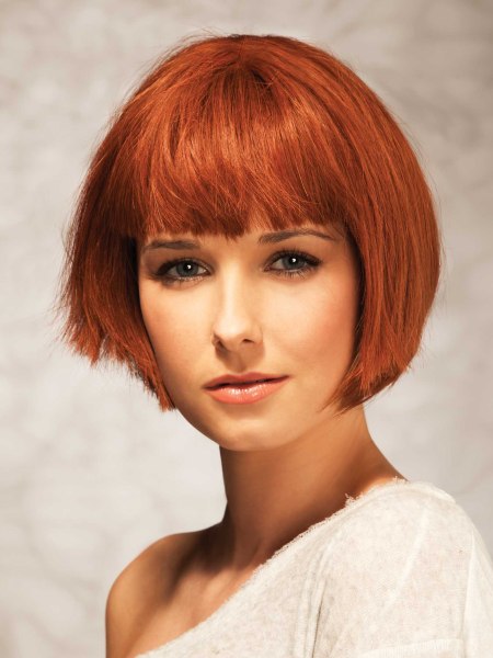 Chin-length bob with bangs just above the eyebrows