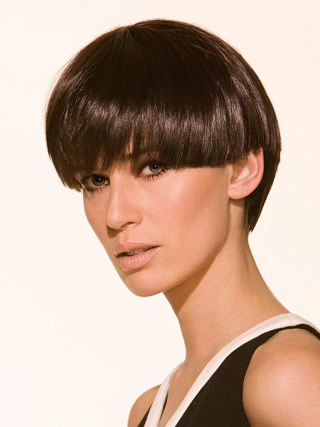 Classic short women's haircut with a longer back and shine