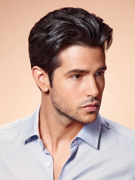 Male short neck and sides haircut with a back-swept fringe