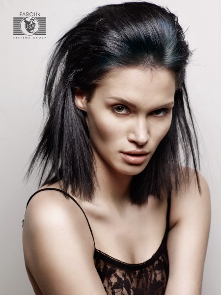 Hair styled back and out of the face