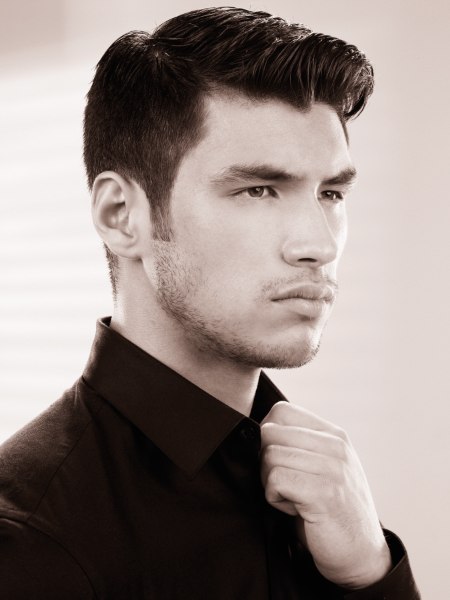Male fashion haircut with short sides and longer top hair