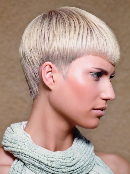 Short haircut with pointy sideburns for blonde with silver hair