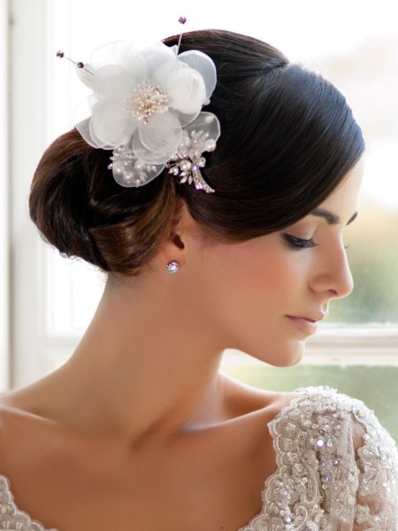 Updo with a transparent organza gardenia flower