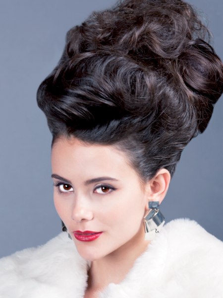 High updo composed of teased sections and large curls