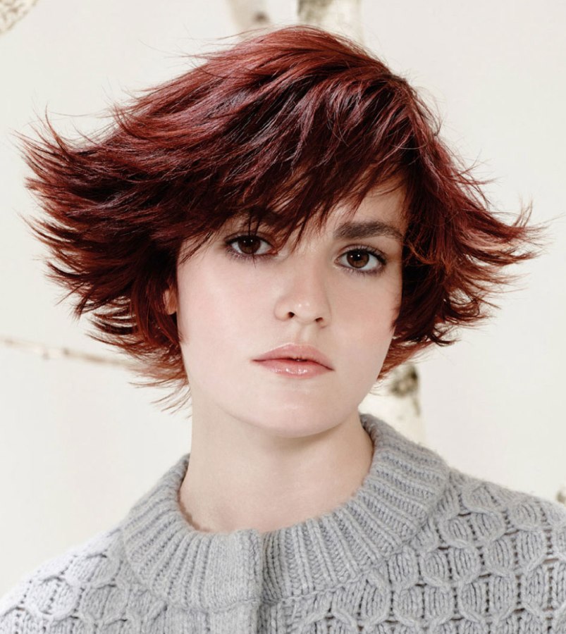 Short mahogany hair with bangs and ends that flip up