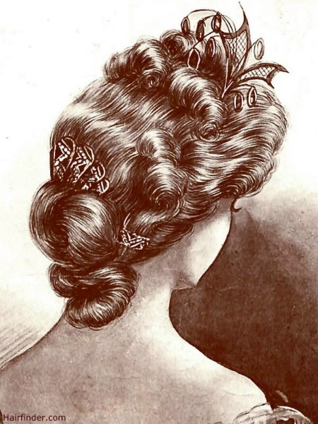 Vintage formal hairstyle with curls, waves, and a chignon