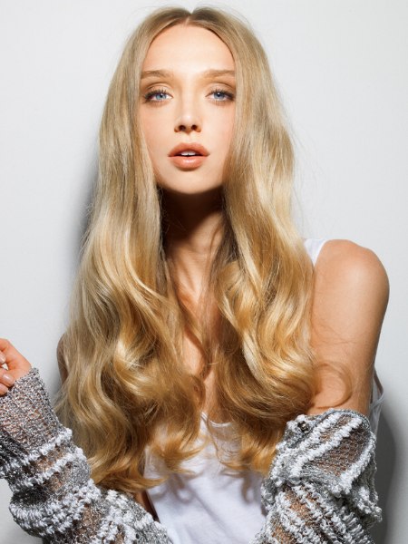 Almost waist-length blonde hair with waves