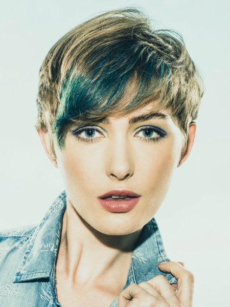 Pixie cut with blue streaks in the fringe