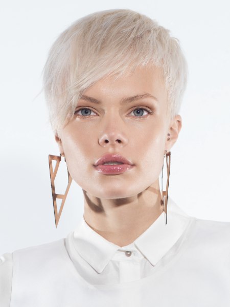 Short pixie cut hairstyle with exposed ears
