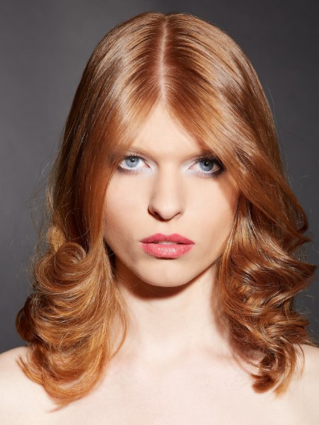 Shoulder length strawberry blonde hair with a center part
