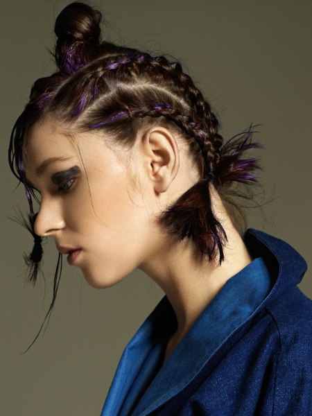 Hair with multiple braids, a bun and purple color accents