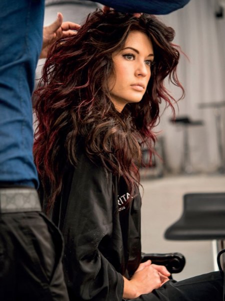 Hair coloring with a play of brown, black, and wine red