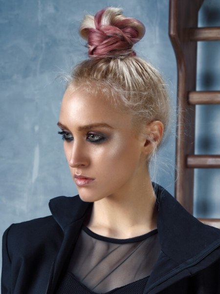 Hair in a pouf on top of the head