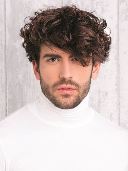 Man with curly hair and a white turtleneck