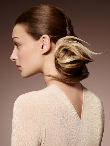 Preppy updo with a low on the neck chignon