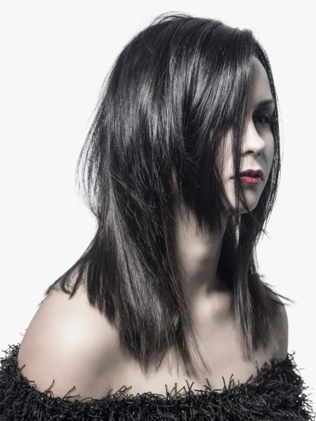Long razor-cut hair with a chin-length section