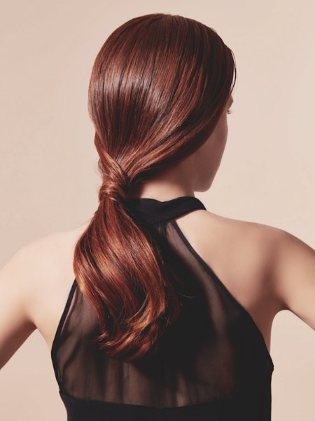 Hairstyle with a glamorous low-slung ponytail
