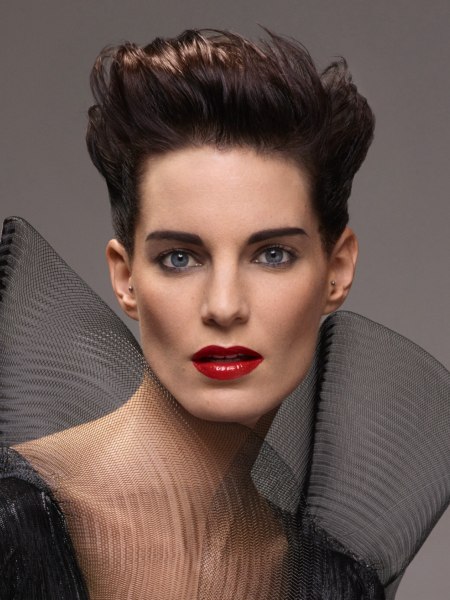 Youthful pixie cut with the hair styled to the back