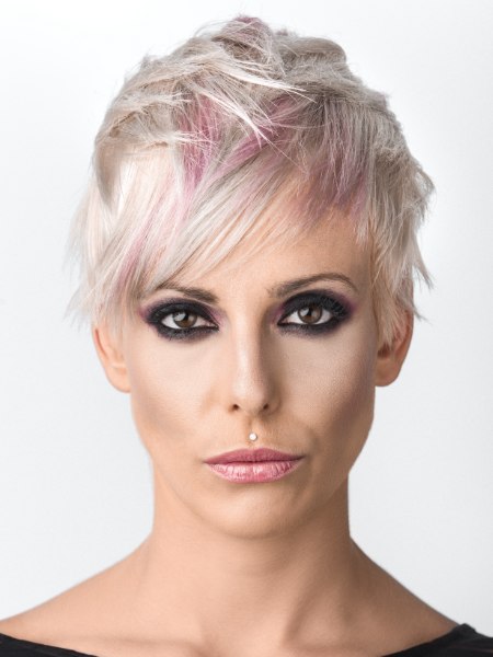 Blonde pixie cut with pink streaks