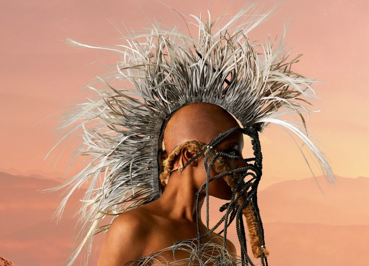 Woman with a futuristic shaved head and Mohawk headdress