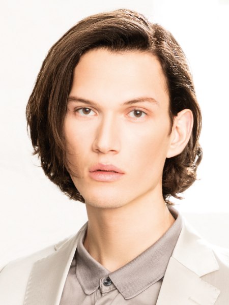 Longer than ear length hairstyle for men