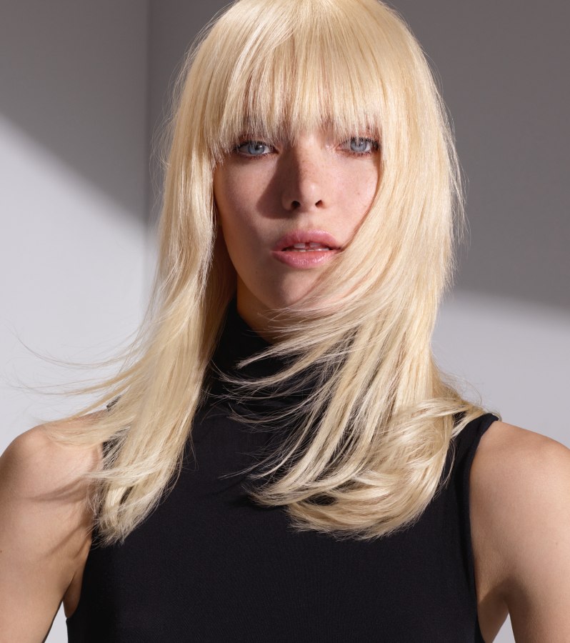 Sophisticated long blonde hair with full bangs