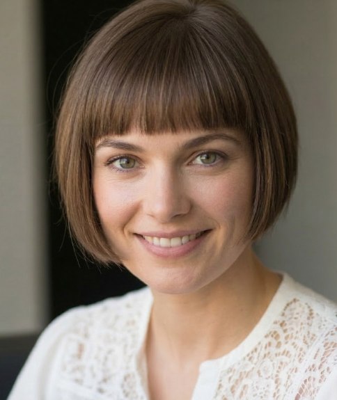 Short bob with a blunt, just above the eyebrows fringe
