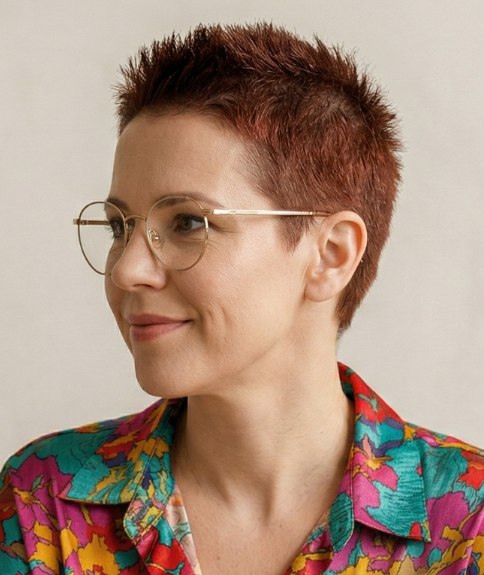 Woman with red hair, in a buzz cut
