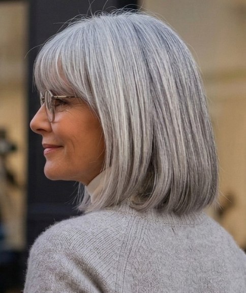 Silver-gray hair, cut in a long bob