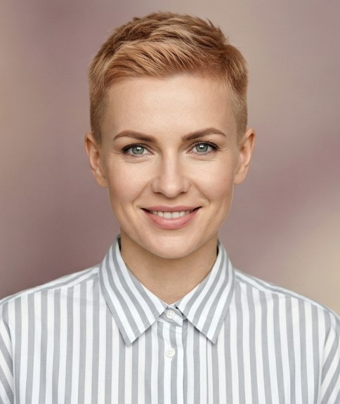 Woman with a rebellious short haircut and wearing an oversized shirt