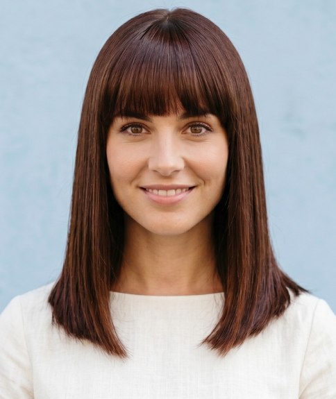 Long and smooth brown hair with blunt bangs