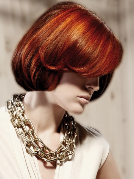 Side view of an elegant bob for hair with red hues