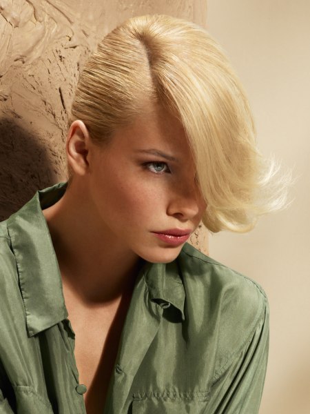 Half updo with the blonde hair styled towards the front