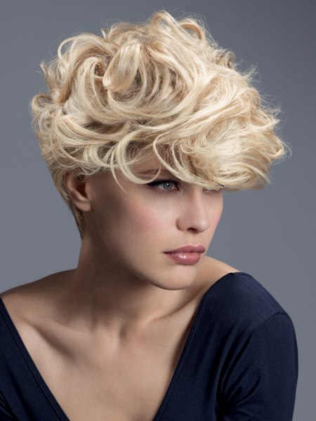 Short blonde hair with longer top hair, curls and waves