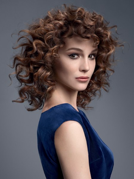 Medium length layered hair with spiral curls